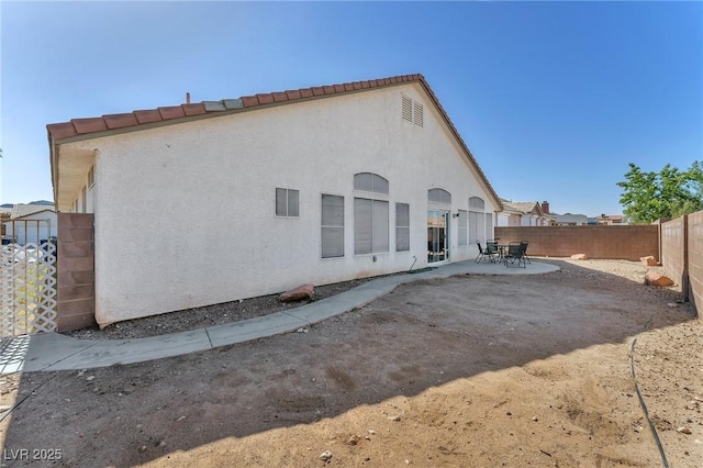2753 Trickling Brook Ct, Las Vegas, NV 89156 - back of property featuring a fenced backyard, a patio area, and stucco siding