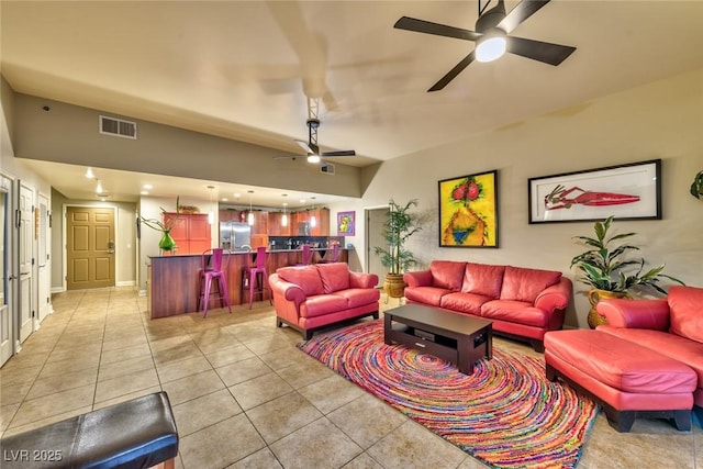 150 Las Vegas Blvd Unit 1606, Las Vegas, NV 89101 - living room with visible vents, a ceiling fan, bar, and light tile patterned floors