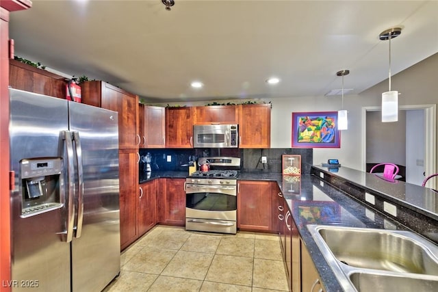 150 Las Vegas Blvd Unit 1606, Las Vegas, NV 89101 - kitchen with backsplash, decorative light fixtures, a sink, light tile patterned floors, and stainless steel appliances