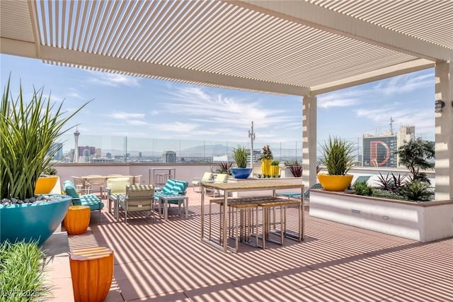 150 Las Vegas Blvd Unit 1606, Las Vegas, NV 89101 - view of patio with a view of city, outdoor dining area, and a pergola