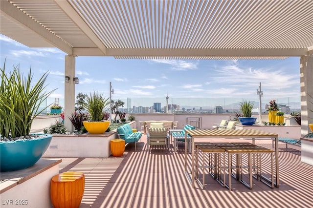 150 Las Vegas Blvd Unit 1606, Las Vegas, NV 89101 - view of patio / terrace featuring a city view, a pergola, and outdoor dining space
