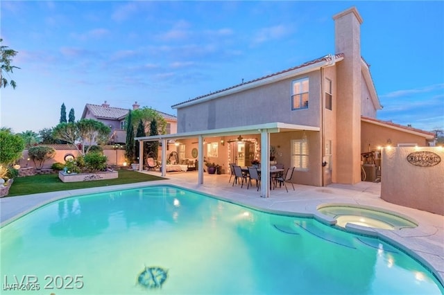 3950 Candleglow Ct, Las Vegas, NV 89147 - rear view of house featuring a fenced backyard, stucco siding, a chimney, a ceiling fan, and a patio area