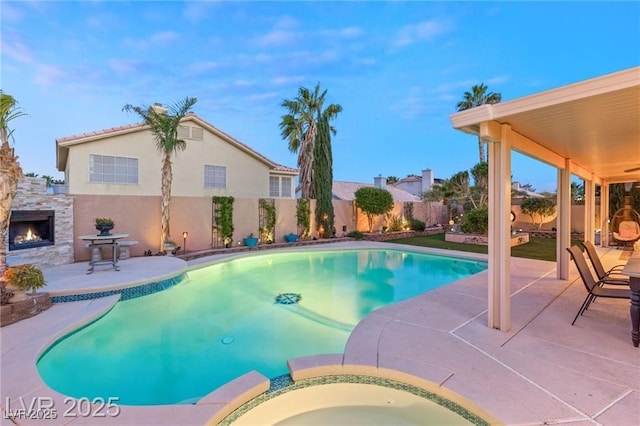 3950 Candleglow Ct, Las Vegas, NV 89147 - view of pool with a fenced backyard, a patio area, and a pool with connected hot tub
