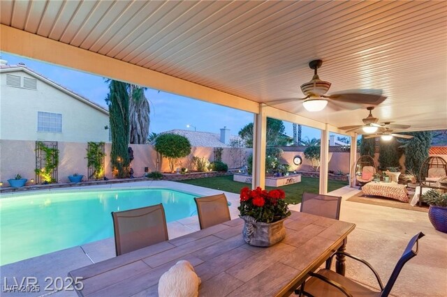 3950 Candleglow Ct, Las Vegas, NV 89147 - view of pool with a fenced backyard, a fenced in pool, a ceiling fan, a patio area, and outdoor dining space