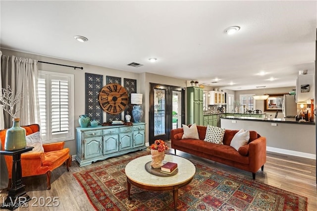 3950 Candleglow Ct, Las Vegas, NV 89147 - living area featuring recessed lighting, baseboards, visible vents, and wood finished floors