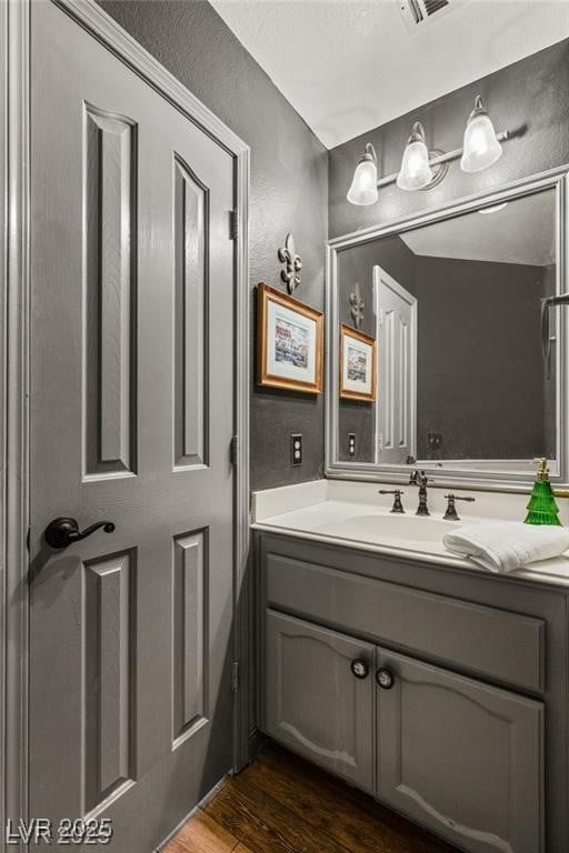 3950 Candleglow Ct, Las Vegas, NV 89147 - bathroom with wood finished floors and vanity