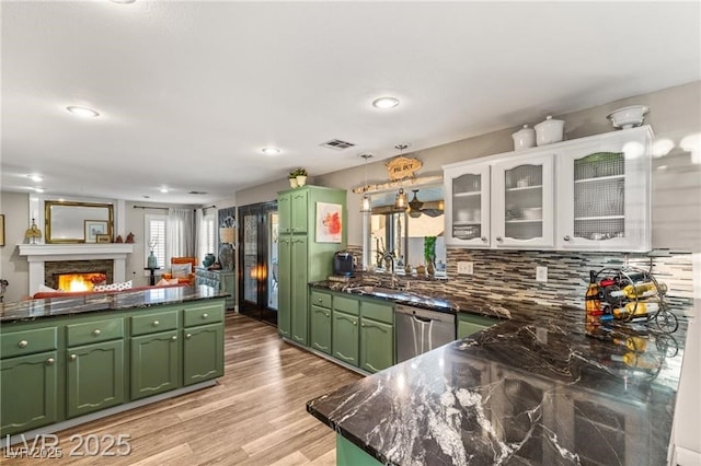 3950 Candleglow Ct, Las Vegas, NV 89147 - kitchen featuring a sink, stainless steel dishwasher, green cabinets, and visible vents