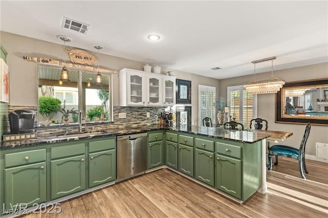 3950 Candleglow Ct, Las Vegas, NV 89147 - kitchen with visible vents, dishwasher, a sink, green cabinetry, and white cabinetry
