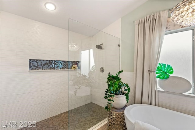 3950 Candleglow Ct, Las Vegas, NV 89147 - bathroom featuring a freestanding tub, a walk in shower, and lofted ceiling