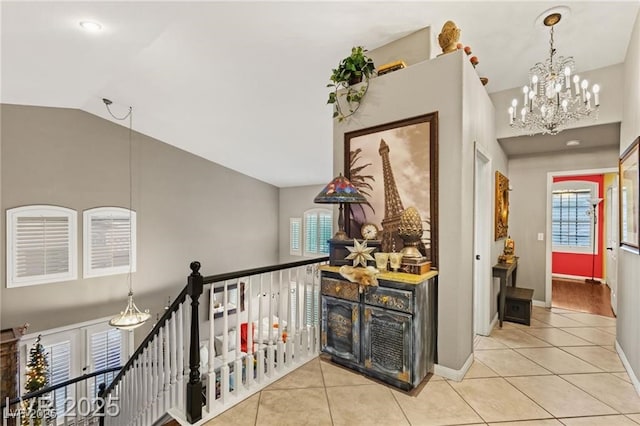 3950 Candleglow Ct, Las Vegas, NV 89147 - corridor with tile patterned floors, lofted ceiling, a chandelier, and an upstairs landing