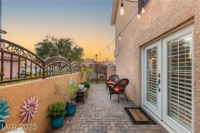3950 Candleglow Ct, Las Vegas, NV 89147 - patio terrace at dusk featuring a gate