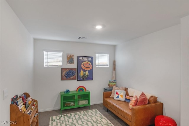 rec room featuring baseboards, a wealth of natural light, carpet floors, and visible vents