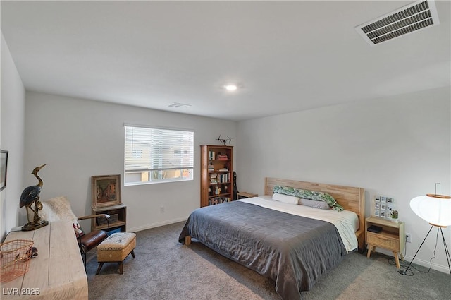 carpeted bedroom with baseboards and visible vents