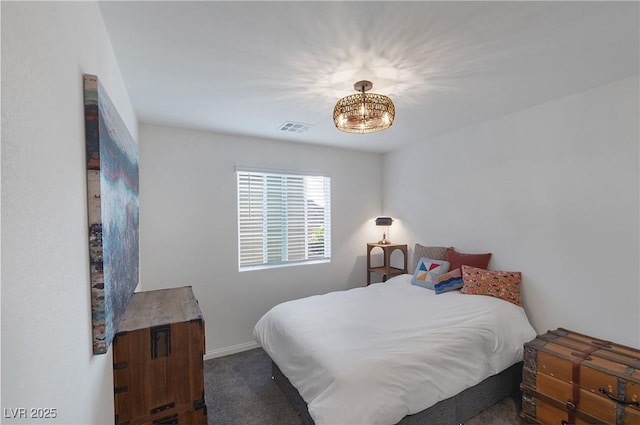 bedroom featuring a notable chandelier, visible vents, baseboards, and carpet