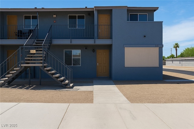 841 A A, Boulder City, NV 89005 - view of front of home featuring stairway and stucco siding