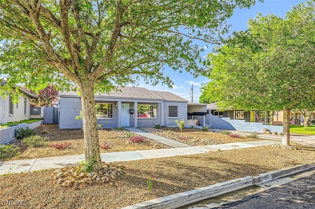 517 7th St, Boulder City, NV 89005 - view of front facade with stucco siding and fence