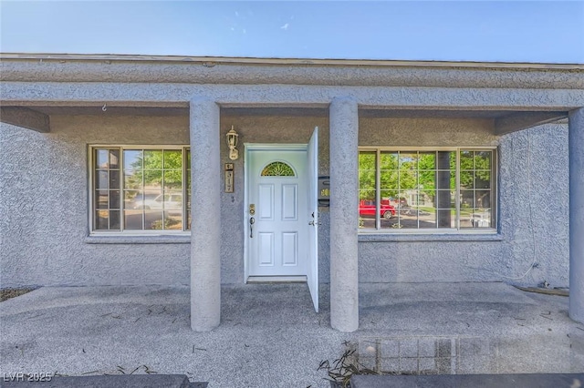 517 7th St, Boulder City, NV 89005 - doorway to property featuring stucco siding