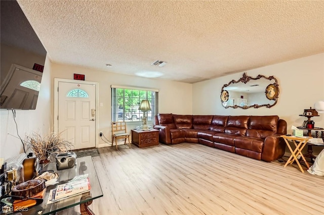 517 7th St, Boulder City, NV 89005 - living room featuring a textured ceiling and wood finished floors
