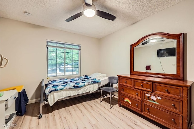 517 7th St, Boulder City, NV 89005 - bedroom with a textured ceiling, light wood finished floors, and a ceiling fan
