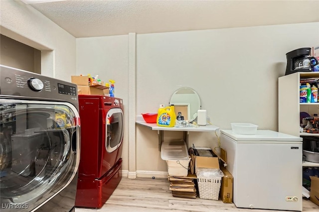 517 7th St, Boulder City, NV 89005 - laundry room with washer and dryer, wood finished floors, and baseboards