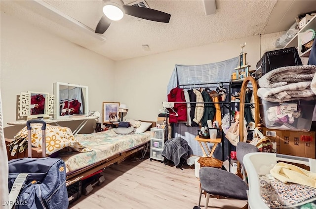 517 7th St, Boulder City, NV 89005 - bedroom with wood finished floors, a textured ceiling, and a ceiling fan