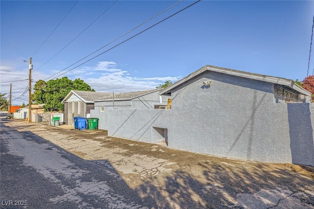517 7th St, Boulder City, NV 89005 - view of side of property featuring stucco siding