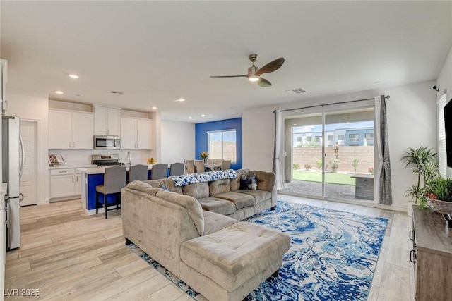 8898 Sasquatch Run Ave, Las Vegas, NV 89166 - living area featuring ceiling fan, recessed lighting, light wood-style flooring, and visible vents