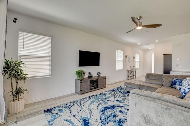 8898 Sasquatch Run Ave, Las Vegas, NV 89166 - living area featuring a ceiling fan, baseboards, recessed lighting, and wood finished floors