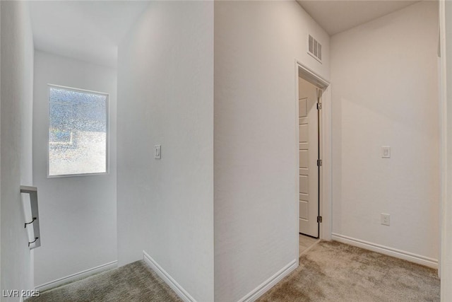 8898 Sasquatch Run Ave, Las Vegas, NV 89166 - hallway with baseboards, carpet flooring, and visible vents