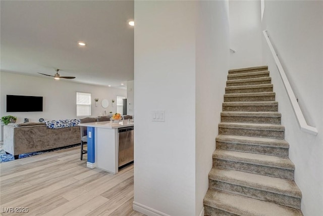 8898 Sasquatch Run Ave, Las Vegas, NV 89166 - stairway with a ceiling fan, recessed lighting, and wood finished floors