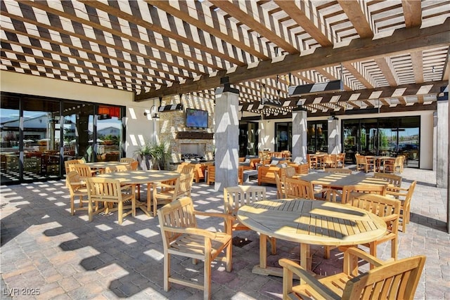 8898 Sasquatch Run Ave, Las Vegas, NV 89166 - view of patio / terrace with outdoor dining area, an outdoor fireplace, and a pergola