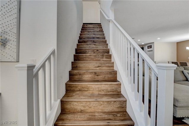 stairs featuring recessed lighting