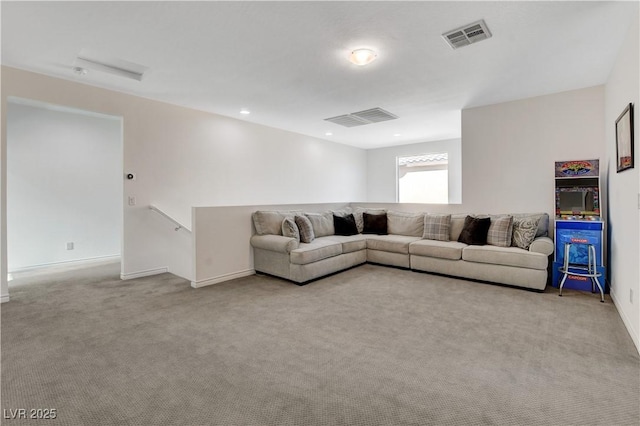 living room with visible vents, carpet flooring, and baseboards