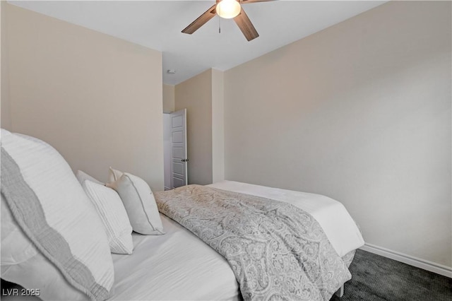 carpeted bedroom with baseboards and ceiling fan