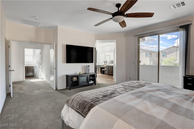 bedroom featuring access to outside, visible vents, multiple windows, and ensuite bathroom