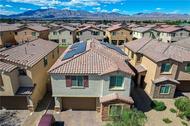 bird's eye view with a residential view and a mountain view