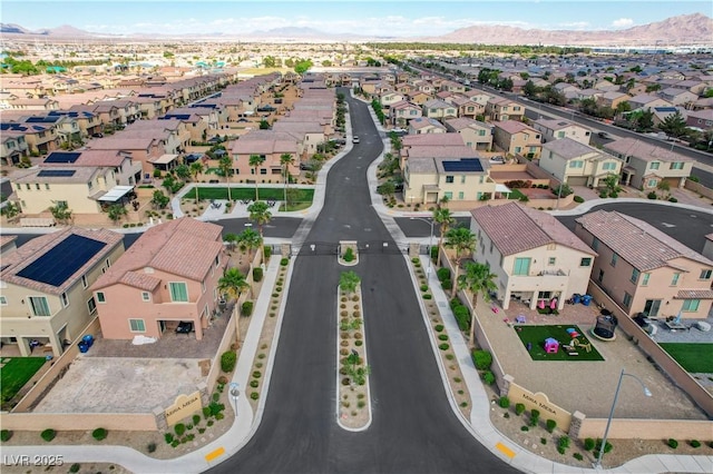 drone / aerial view with a residential view and a mountain view