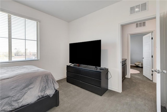 bedroom with visible vents, carpet flooring, and baseboards