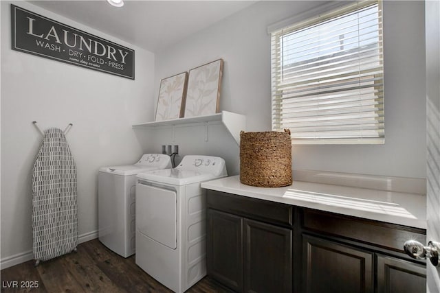 clothes washing area with separate washer and dryer, baseboards, dark wood-style floors, and cabinet space