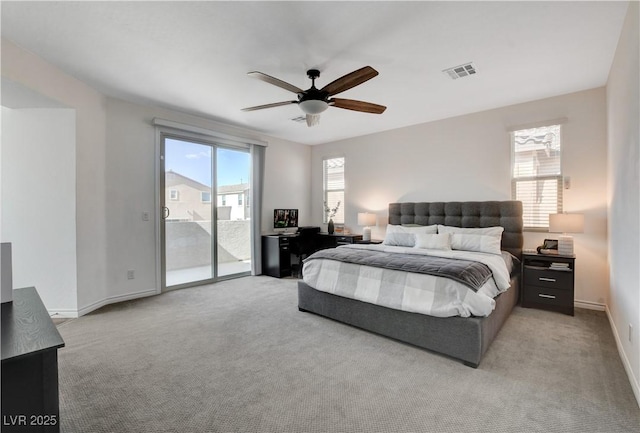 bedroom with light colored carpet, visible vents, access to exterior, and multiple windows