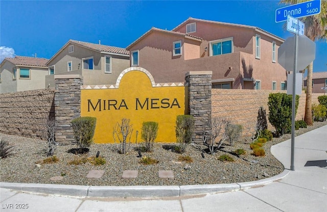 community sign with fence