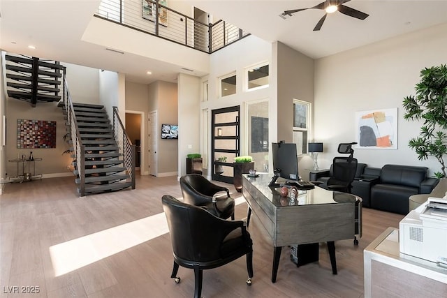 5436 Succulent Rose Dr, Las Vegas, NV 89135 - office space with a ceiling fan, baseboards, wood finished floors, a towering ceiling, and visible vents