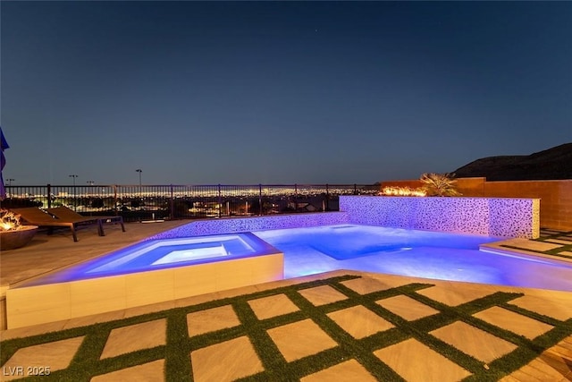 5436 Succulent Rose Dr, Las Vegas, NV 89135 - pool at twilight with fence, an in ground hot tub, and a fenced in pool