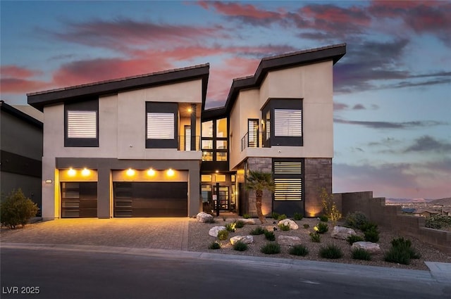 5436 Succulent Rose Dr, Las Vegas, NV 89135 - modern home with an attached garage, driveway, stucco siding, and a balcony