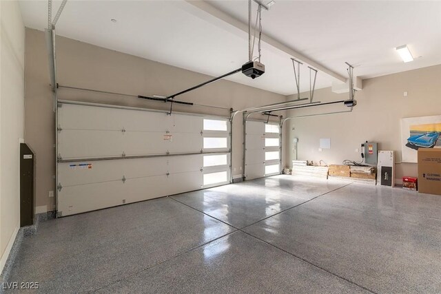 5436 Succulent Rose Dr, Las Vegas, NV 89135 - garage featuring baseboards and a garage door opener