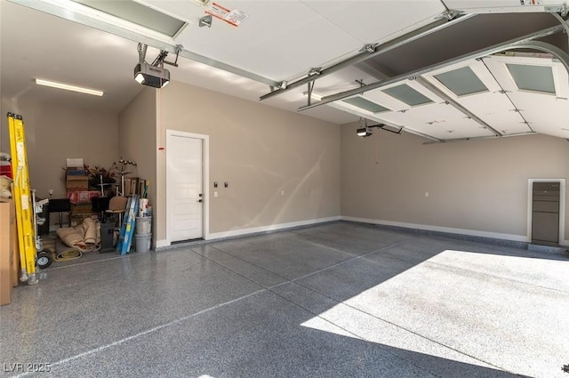 5436 Succulent Rose Dr, Las Vegas, NV 89135 - garage with baseboards and a garage door opener