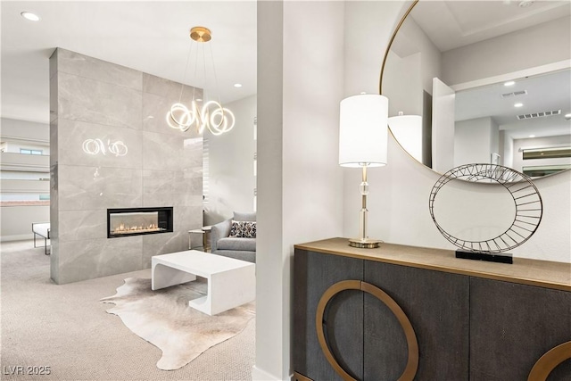 interior space featuring baseboards, carpet flooring, recessed lighting, and visible vents