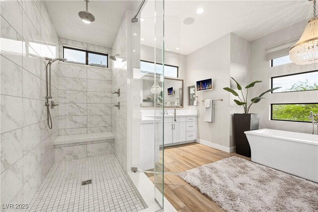 bathroom featuring a shower stall and a healthy amount of sunlight