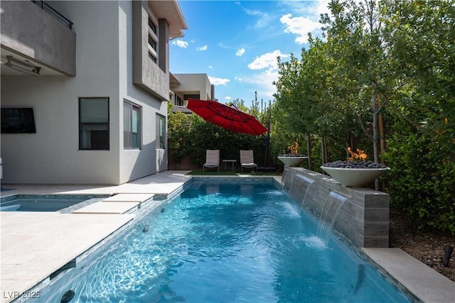 outdoor pool featuring a patio