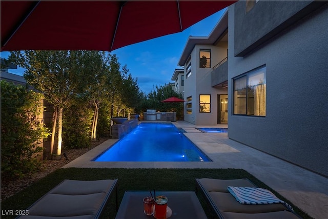 outdoor pool featuring a patio
